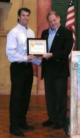 Tom receiving Ambassador of the Quarter award