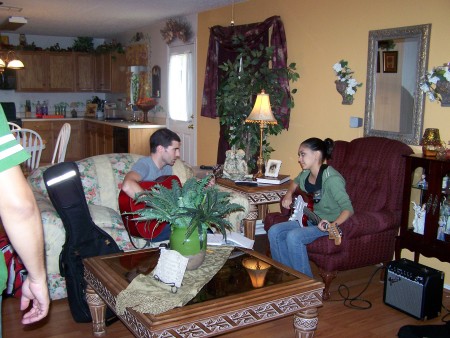Ellison & her guitar teacher at our old house