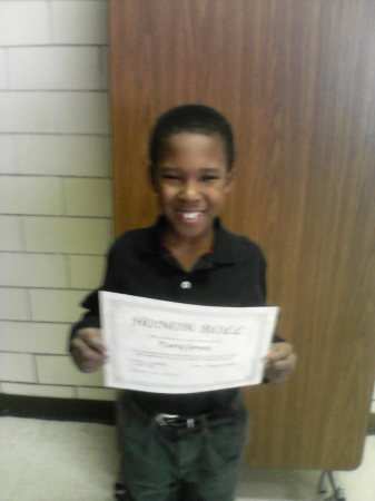 Tariq with his Honor Roll Certificate