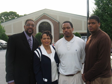 Me with wife and two sons at church