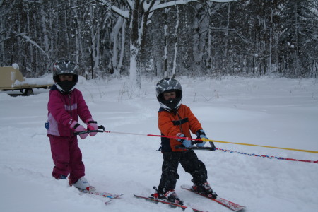 The kids skiing in our yard