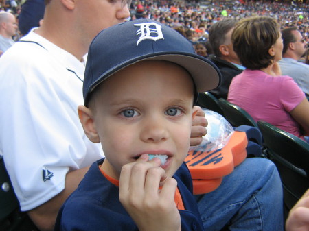 Colin enjoying cotton candy at his first Tigers game