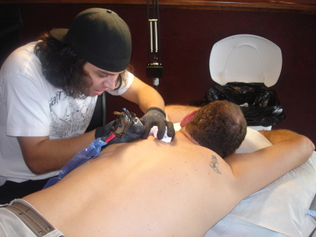 Getting a Tat from DIZZILE of INKED