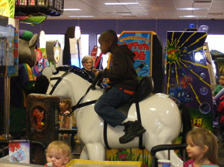 Grandson Ramel riding his horse.