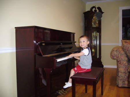 Thomas "playing" the piano.