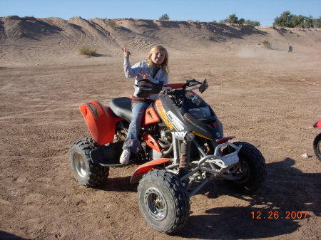 My daughter Raven on daddys quad