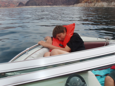 my son dylan on our boat at the lake