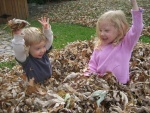 Joey and Jaclyn playing in the leaves