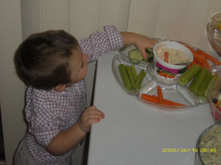 my son sneaking into the food