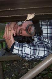 Hubby catchin' a catnap on a picnic table after a long day of riding