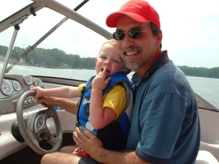 Letting my Grandson drive the boat