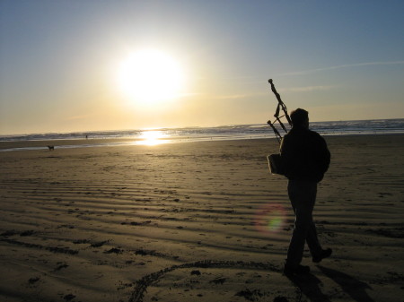 Playing pipes on the beach