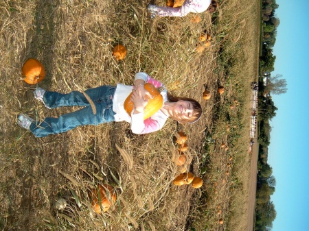 Maggie picking out her Fall pumpkin