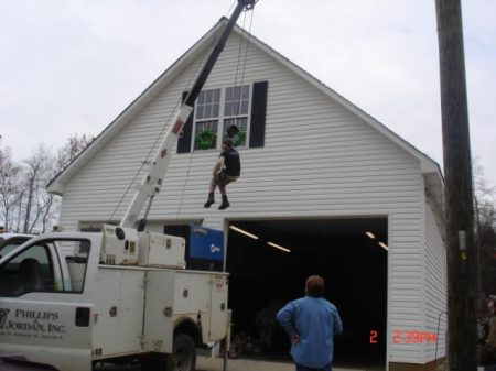 Hanging Christmas lights.