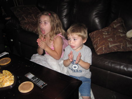 Kids watching Buffalo Bills game.