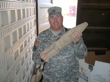 Me with burned out Iraqi artillery round