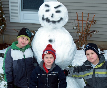 kids and their snowman
