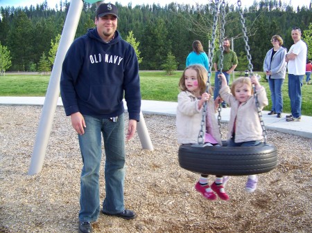 Daddy pushing Laney and Anaya