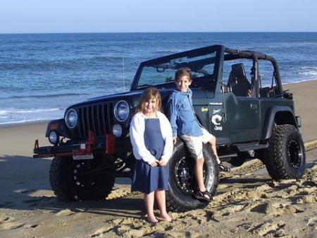 The Granbabies, Jules and Trey, by Dad's Jeep