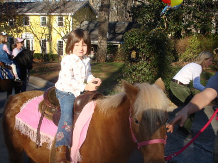 Olivia and her first pony ride