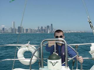 My son, Troy at the helm