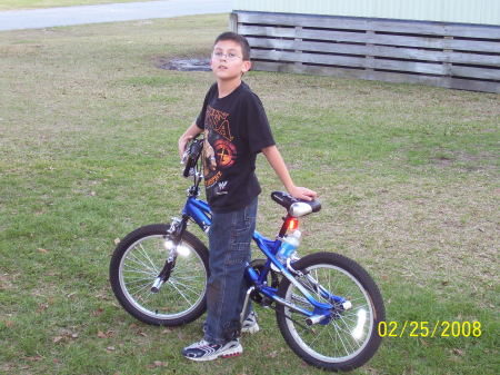 Sidney riding his bike.