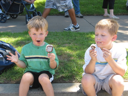 2 Boys Enjoying Ice Cream Bars on hot day