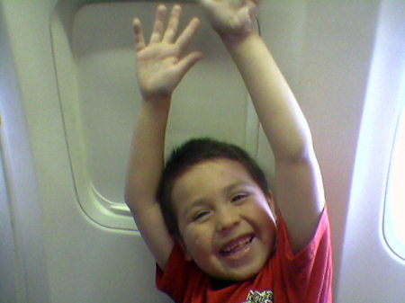 Dominic on the airplane flying home to Phoenix