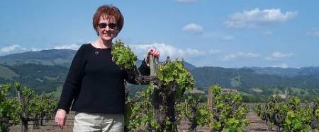 Cathy with the grape vines