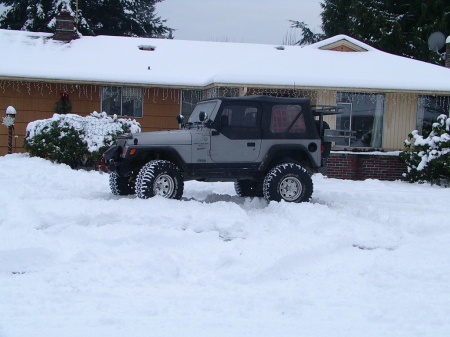 my jeep and my house and the snow