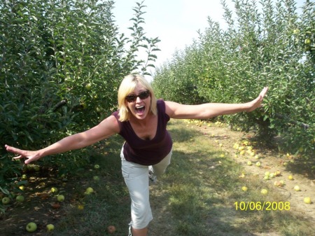 Flying down apple orchard.