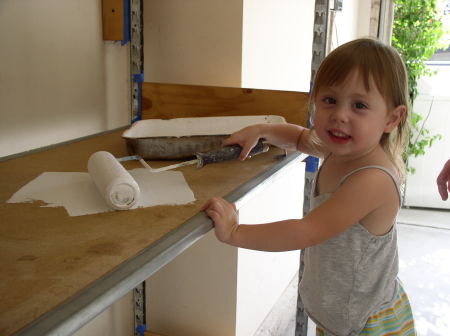 Ashley loves to help Daddy in the garage.