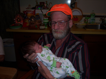 LARRY WITH NEW GRANDSON