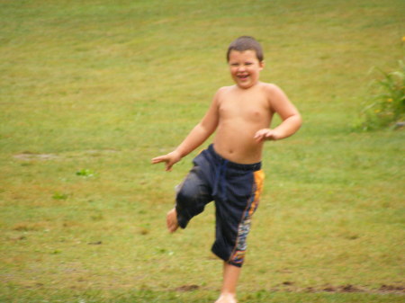 Ethan playin in the mud at Summer Camp
