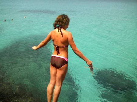 Lucy jumping off our cliff in Jamaica!