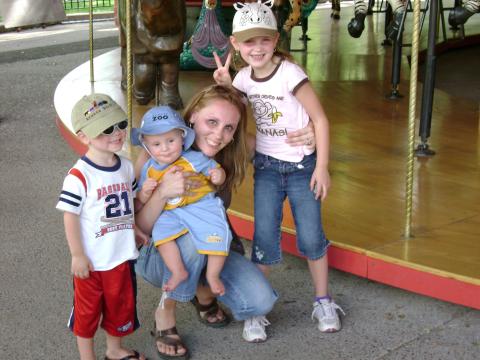 Michael, Joshua, me and Cheyla after our ride on the carosel