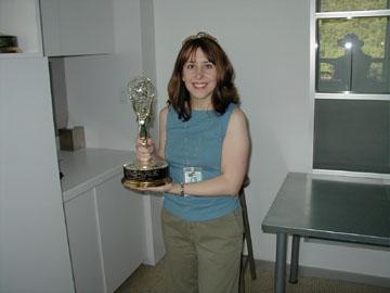 Holding Emmy Award