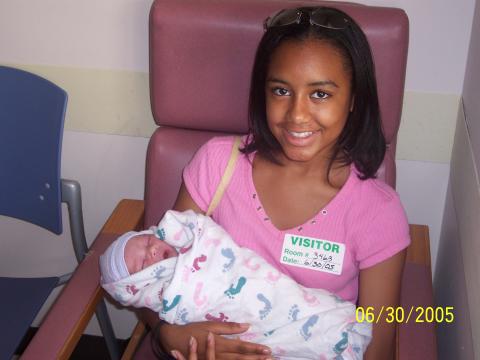 Big sis holding day old Jayna