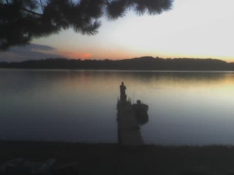 me on our cabin's dock in Minnesota