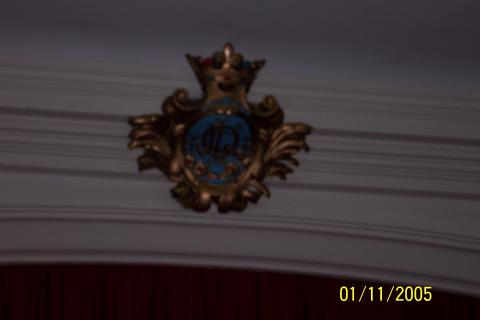 OLL emblem above stage