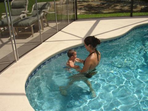 Jayden and I swimming in the pool at my house