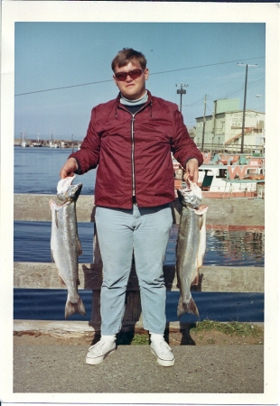 Me on fishing trip '67,nice catch too.........