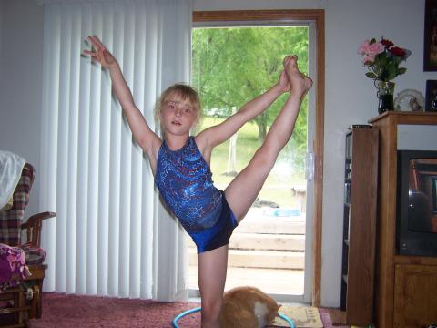 Danica practicing gymnastics at home
