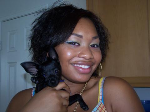 My daughter Kiah & her dog Versace