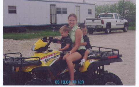 mom, chase and blake 4 wheeling at the ranch