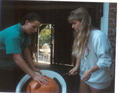 Carving pumpkins with her brother John for Halloween
