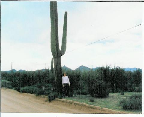 Denise Ogletree Presley standing by a Cactus in Scottsdale AZ.