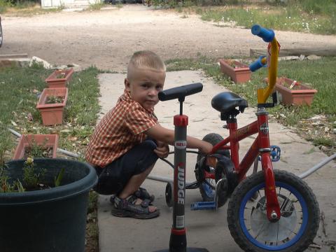Caleb:"fixin' his bike" July 04