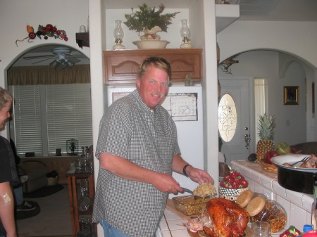 My hubbie trimming the thanksgiving bird