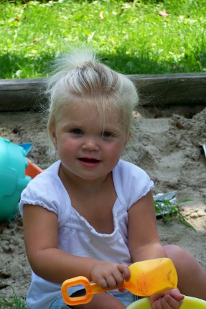 Ella playing in the sand.
